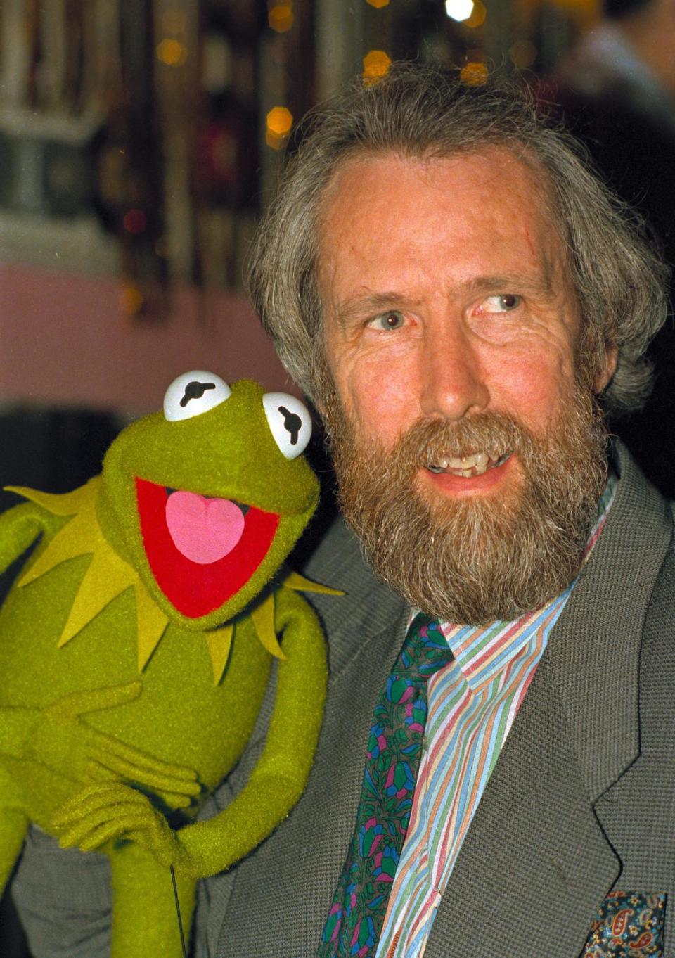 FILE - In this Feb. 1988 file photo, Jim Henson, creator of the Muppets, poses with Kermit the Frog. Kermit, Miss Piggy, Bert and Ernie of "Sesame Street" fame, the stars of "Fraggle Rock" and other puppets, costumes and items from throughout Henson's career have been donated to the Museum of the Moving Image, which is building a new gallery to house them, the institution announced Tuesday, May 21, 2013. (AP Photo/file)