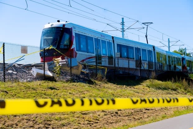 Caution tape is strung up next to the site of an LRT train derailment on Ottawa's Confederation Line on Sept. 19, 2021. No one was injured when the train left the tracks. (Nicholas Cleroux/Radio-Canada - image credit)