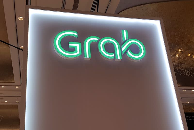 A Grab logo is pictured at the Money 20/20 Asia Fintech Trade Show in Singapore