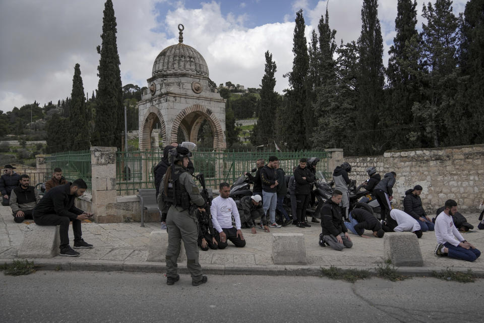 Palestinian Muslim worshipers who were prevented from entering the Al-Aqsa Mosque compound, pray outside Jerusalem's Old City, Friday, March 8, 2024. Restrictions put in place amid the Israel-Hamas war have left many Palestinians concerned they might not be able to pray at the mosque, which is revered by Muslims. (AP Photo/Mahmoud Illean)