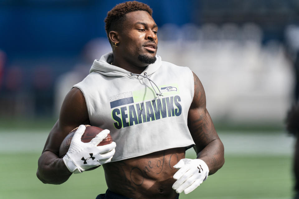 FILE - Seattle Seahawks wide receiver DK Metcalf runs with the ball during warmups before an NFL football game against the Dallas Cowboys in Seattle, in this Sunday, Sept. 27, 2020, file photo. Metcalf has accepted an invitation to run the 100 meters at the USA Track and Field Golden Games in Walnut, California. (AP Photo/Stephen Brashear, File)