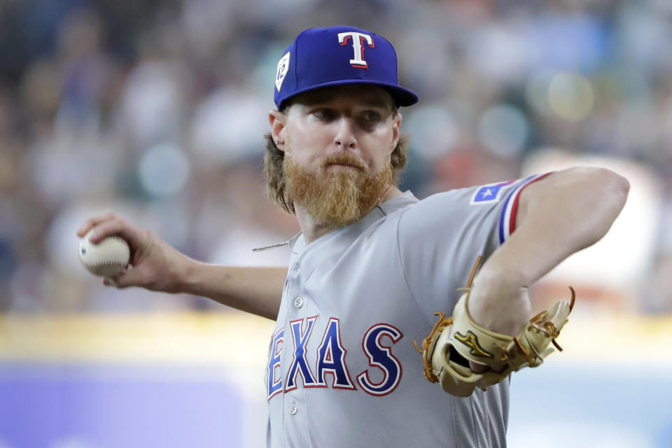 Texas Rangers starting pitcher Jon Gray throws to a Houston Astros batter during the first inning of a baseball game Saturday, April 15, 2023, in Houston. (AP Photo/Michael Wyke)