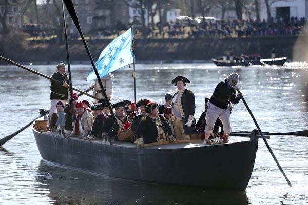 John Godzieba, as Gen. George Washington, second right, stands in a boat during a re-enactment of Washington's daring Christmas 1776 crossing of the Delaware River in Washington Crossing, Pa., on Dec. 25, 2016.  Spectators were once again being invited to gather along the Delaware River to watch an annual reenactment of George Washingtonâ€™s crossing of the Delaware River on Christmas Day, Saturday, Dec. 25, 2021,  a year after an online re-enactment was posted instead.