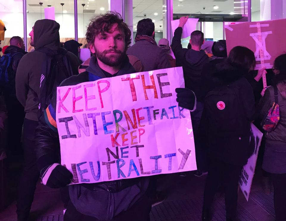 Net neutrality supporter Mislav Forrester at a rally in front of a Verizon store on 42nd Street in New York City on Dec. 7. (Photo: Jenna Amatulli)