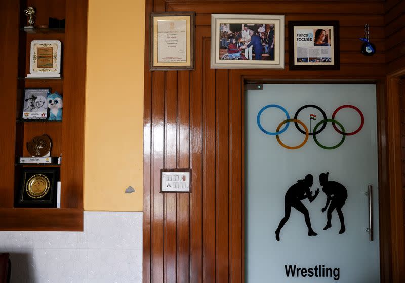 A wall at the residence of Indian wrestler Vinesh Phogat is adorned with awards and pictures in Sonipat