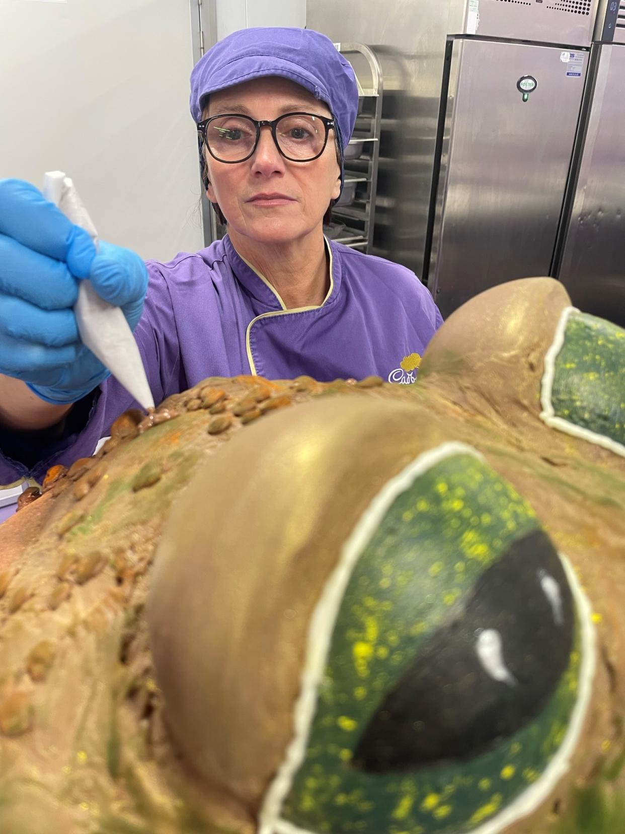 Ms Oluban working on the chocolate creation (Phil Barnett/PA)