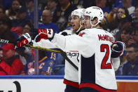 Washington Capitals center Connor McMichael, right, celebrates his goal against the Buffalo Sabres with right wing T.J. Oshie (77) during the second period of an NHL hockey game Thursday, April 11, 2024, in Buffalo, N.Y. (AP Photo/Jeffrey T. Barnes)