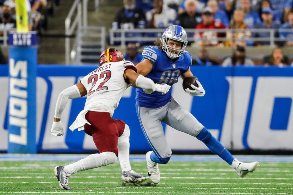 Sep 18, 2022; Detroit, Michigan, USA;  Detroit Lions tight end T.J. Hockenson (88) runs against Washington Commanders safety Darrick Forrest (22) during the second half at Ford Field.