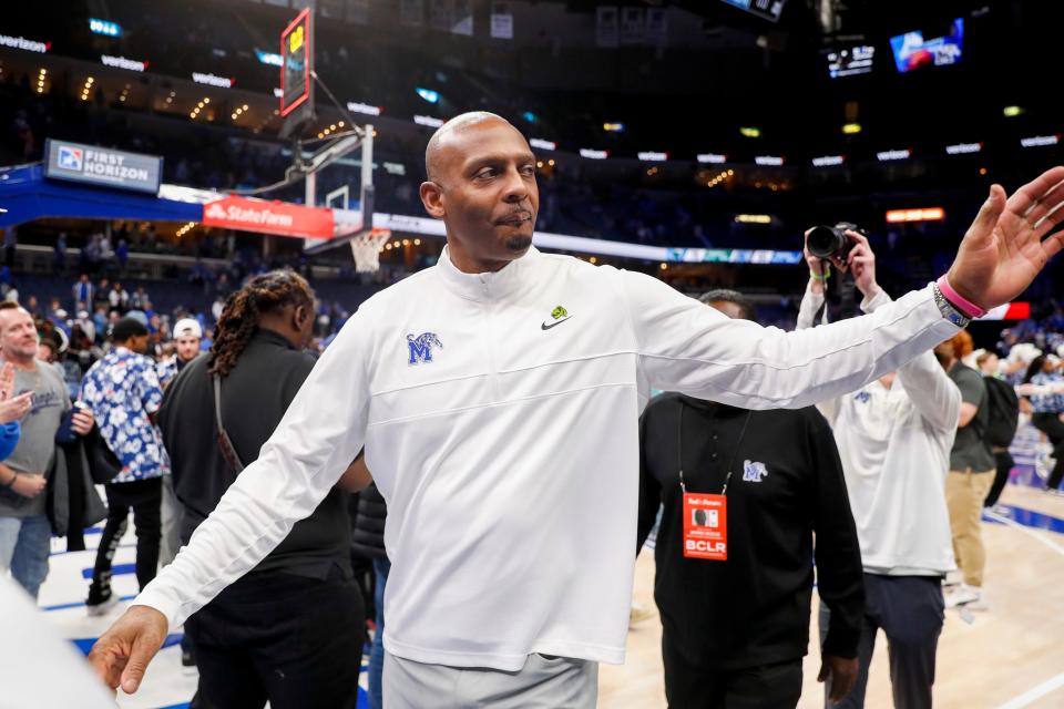 Memphis' head coach Penny Hardaway high fives fans as he walks off the court after Memphis defeated Tulane 90-78 at FedExForum in Memphis, Tenn., on Sunday, February 11, 2024.