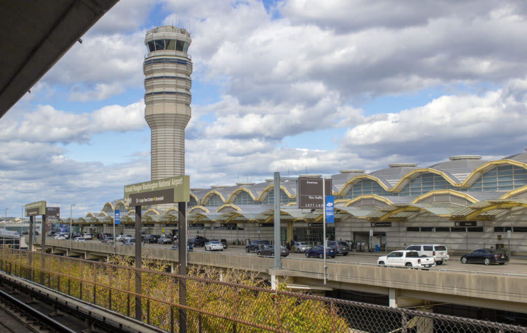 A deal for FAA reauthorization would add flights to Ronald Reagan Washington National Airport, despite opposition from U.S. senators from Virginia and Maryland, who said in a letter on Monday, April 29, 2024, that the move would hurt safety efforts. Shown is the terminal and air traffic control tower at Washington National. (Photo by Patrick Donovan/Getty Photos)