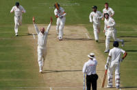 India v Australia - Second Test cricket match - M Chinnaswamy Stadium, Bengaluru, India - 04/03/17. Australia's Nathan Lyon celebrates the wicket of India's Ishant Sharma with his teammates. REUTERS/Danish Siddiqui