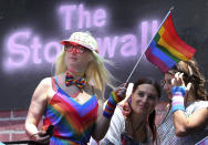 FILE- In this June 26, 2016 file photo, parade participants ride on the Stonewall Inn's float along Fifth Avenue during the New York City Pride Parade. June 2019 Pride Month marks the 50th Anniversary of the Stonewall uprising, which fueled the fire for a global LGBTQ movement, with events that commemorate that moment and its impact through the last five decades. (AP Photo/Mel Evans, File)