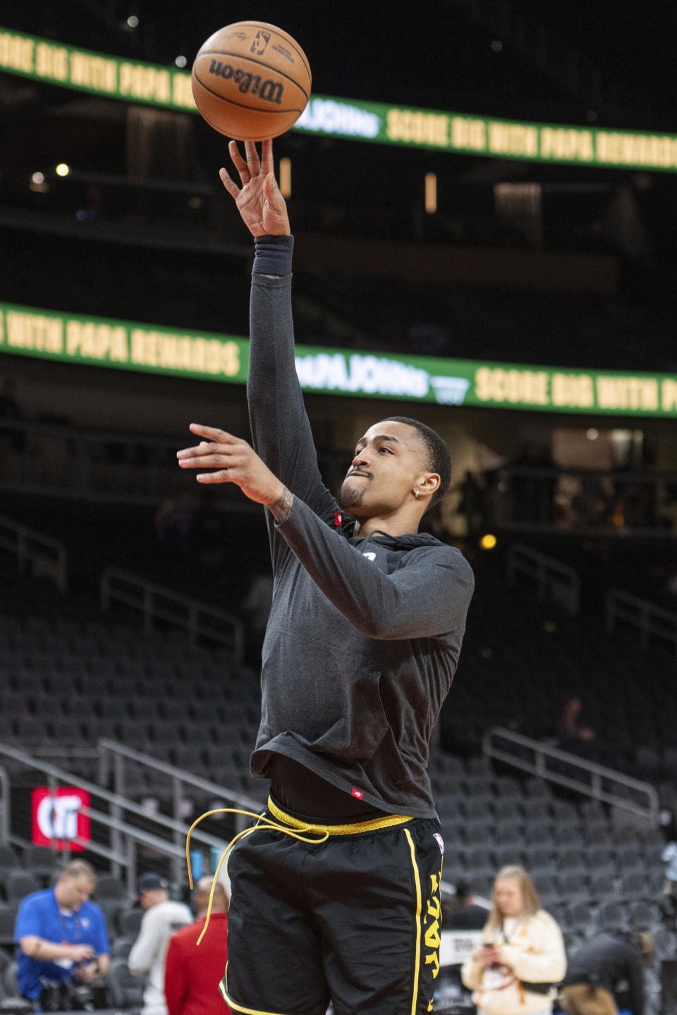 Utah Jazz forward John Collins warms up for the team's NBA basketball game against the Atlanta Hawks, Tuesday, Feb. 27, 2024, in Atlanta. (AP Photo/Hakim Wright Sr.)