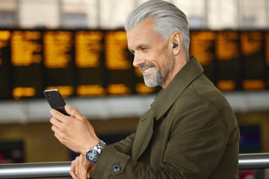The Jabra Enhance Plus being used by an elderly man.