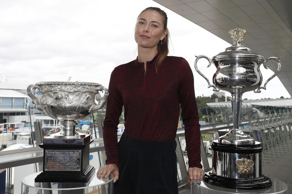 Maria Sharapova poses with the Australian Open trophies ahead of the 2020 Australian Open.