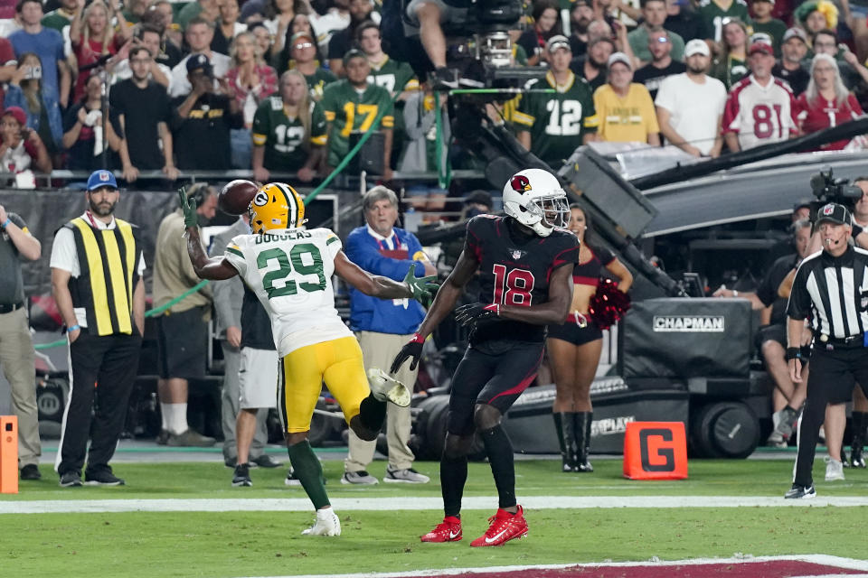 Green Bay Packers cornerback Rasul Douglas (29) intercepts a pass intended for Arizona Cardinals wide receiver A.J. Green (18) in the end zone during the second half of an NFL football game, Thursday, Oct. 28, 2021, in Glendale, Ariz. The Packers won 24-21. (AP Photo/Ross D. Franklin)