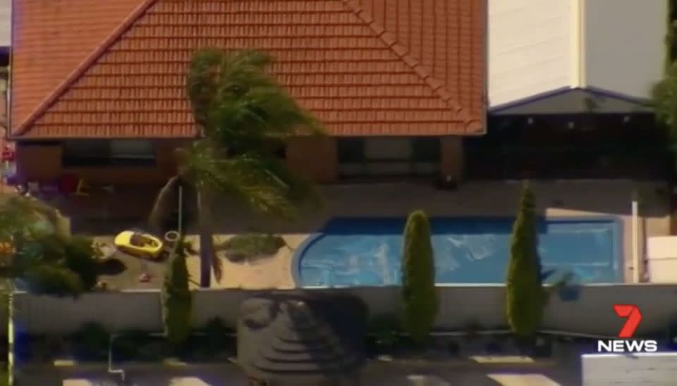 The toddler is believed to have climbed on top of a pot plant to get over the pool fence. Source: 7 News