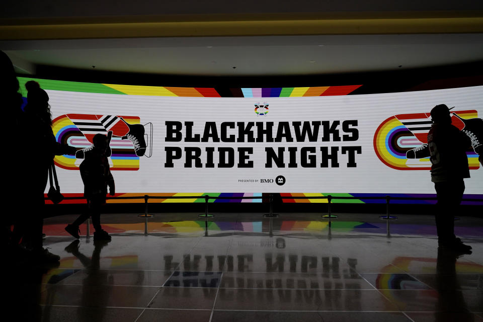 A big screen shows "Blackhawks Pride Night," before an NHL hockey game between the Vancouver Canucks and the Chicago Blackhawks in Chicago, Sunday, March 26, 2023. (AP Photo/Nam Y. Huh)