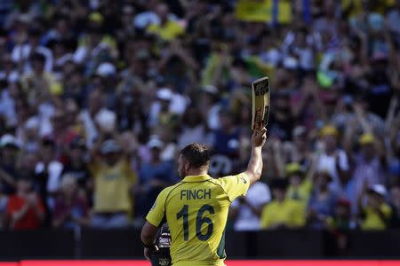 Australia's Aaron Finch reacts as he walks off the ground after being dismissed for 135 runs during the Cricket World Cup match against England at the Melbourne Cricket Ground (MCG) February 14, 2015. REUTERS/Hamish Blair
