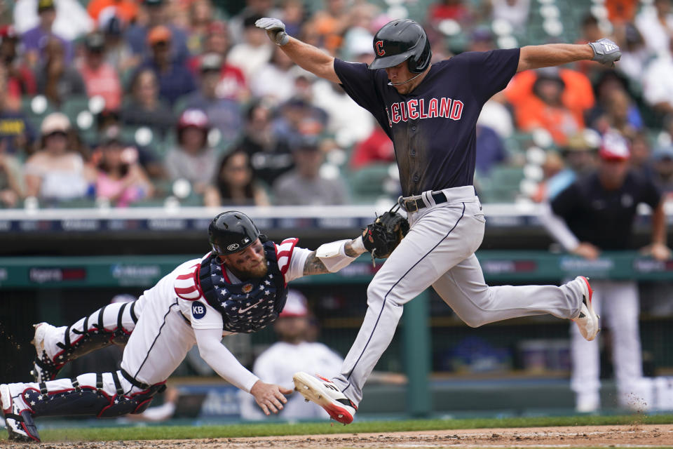 Detroit Tigers catcher Tucker Barnhart tags Cleveland Guardians' Myles Straw out at home plate in the third inning of a baseball game in Detroit, Monday, July 4, 2022. (AP Photo/Paul Sancya)