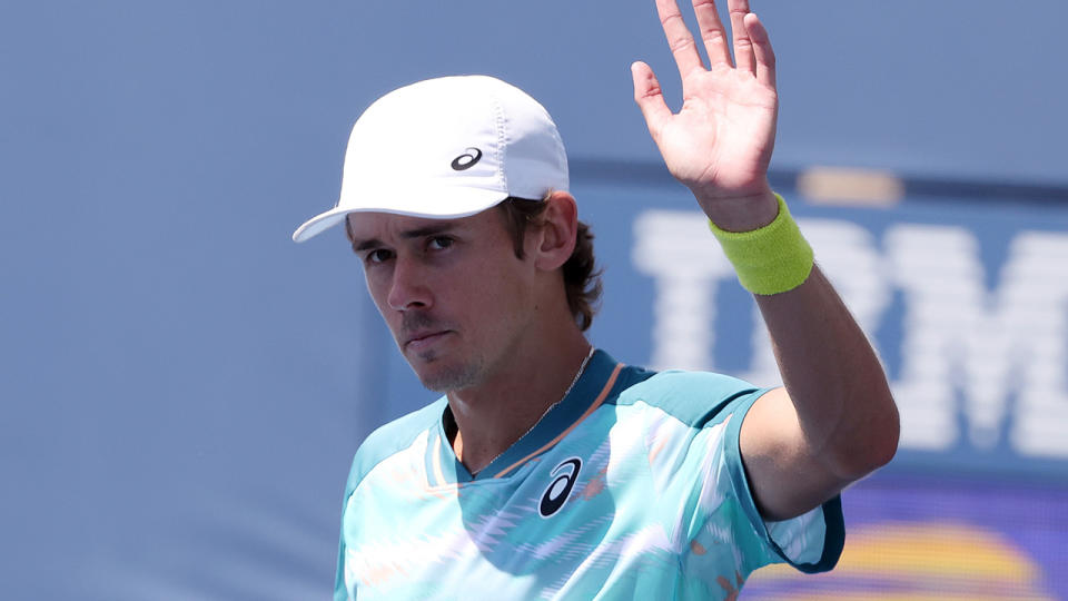 Alex de Minaur waves to the crowd at the US Open.