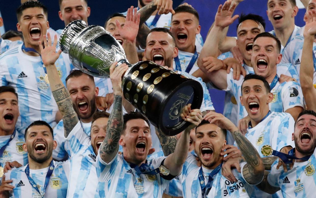 Lionel Messi celebrates with the trophy after beating Brazil 1-0 in the Copa America final - Argentina World Cup 2022 squad list fixtures team news latest odds players - AP/Bruna Prado