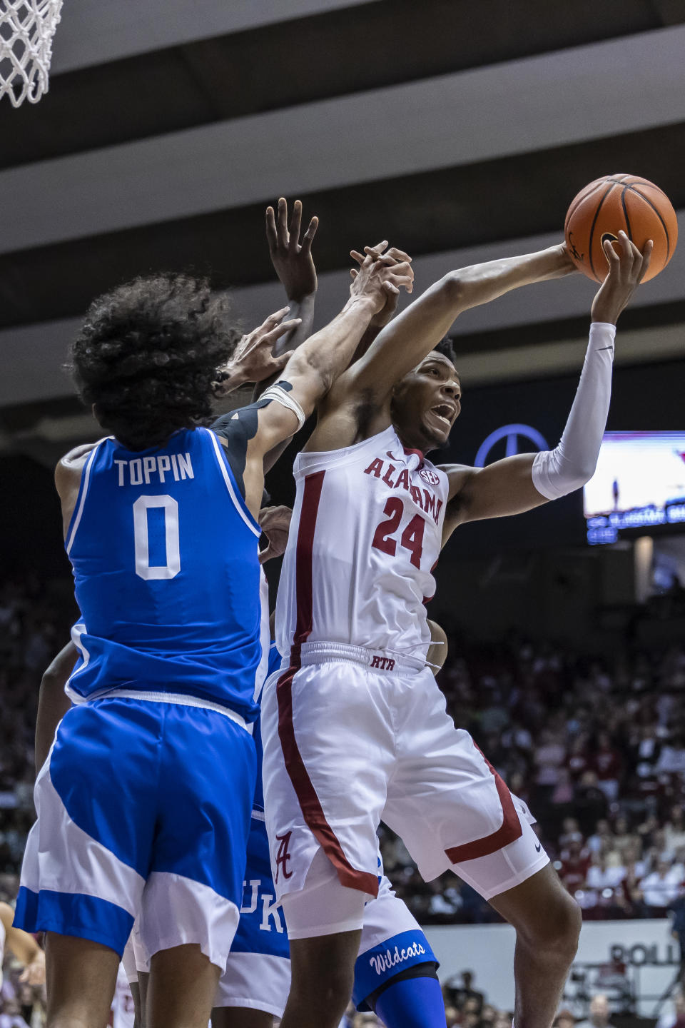Alabama forward Brandon Miller (24) works for a rebound against Kentucky forward Jacob Toppin (0) during the first half of an NCAA college basketball game, Saturday, Jan. 7, 2023, in Tuscaloosa, Ala. (AP Photo/Vasha Hunt)