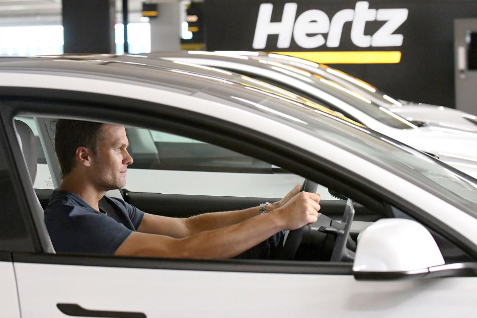 Tom Brady on the set of the Hertz's "Let's Go" campaign celebrating the future of mobility by making electric vehicle rentals fast, seamless and more accessible than ever before.