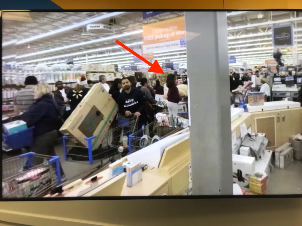 A small child is seen standing in a shopping cart in a Walmart store in a virtual reality training module.