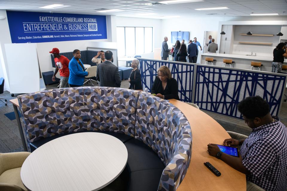 Officials and guests tour the newly opened Fayetteville-Cumberland Regional Entrepreneur and Business Hub at Bronco Square on Wednesday, Sept. 14, 2022. 