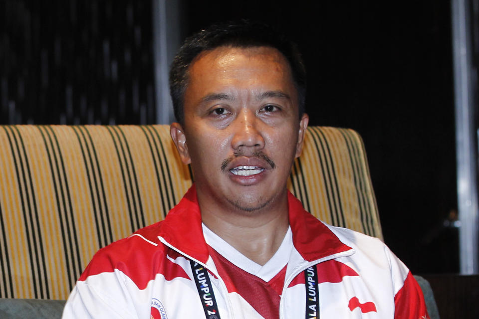 FIEL - In this Aug. 20, 2017, file photo, Indonesian Youth And Sports Minister Imam Nahrawi attends a press conference with Malaysian Youth and Sports Minister Khairy Jamaluddin in which Jamaluddin apologized to Indonesia for the mistake, which makes the red-and-white Indonesian flag resemble Poland's on a guidebook, in Kuala Lumpur, Malaysia. Nahrawi has resigned after being accused of stealing $1.8 million in public money. (AP Photo/Daniel Chan, File)