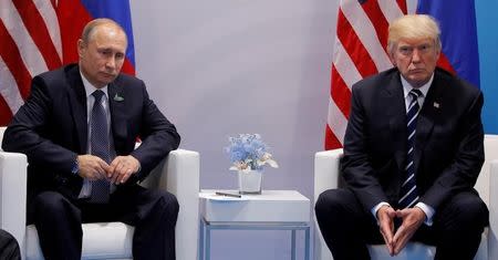 U.S. President Donald Trump meets with Russian President Vladimir Putin during their bilateral meeting at the G20 summit in Hamburg, Germany July 7, 2017. REUTERS/Carlos Barria/Files