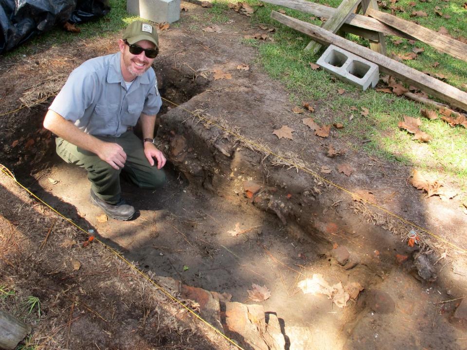 Archaeologist Larry James poses at the site of the excavation of a colonial house on Friday, Oct. 5, 2012 at the Colonial Dorchester State Historic Site in Summerville, S.C. A new tourism campaign by the state South Carolina Department of Parks, Recreation and Tourism is aimed at drawing visitors to such sites that tourism officials call undiscovered South Carolina. (AP Photo/Bruce Smith).