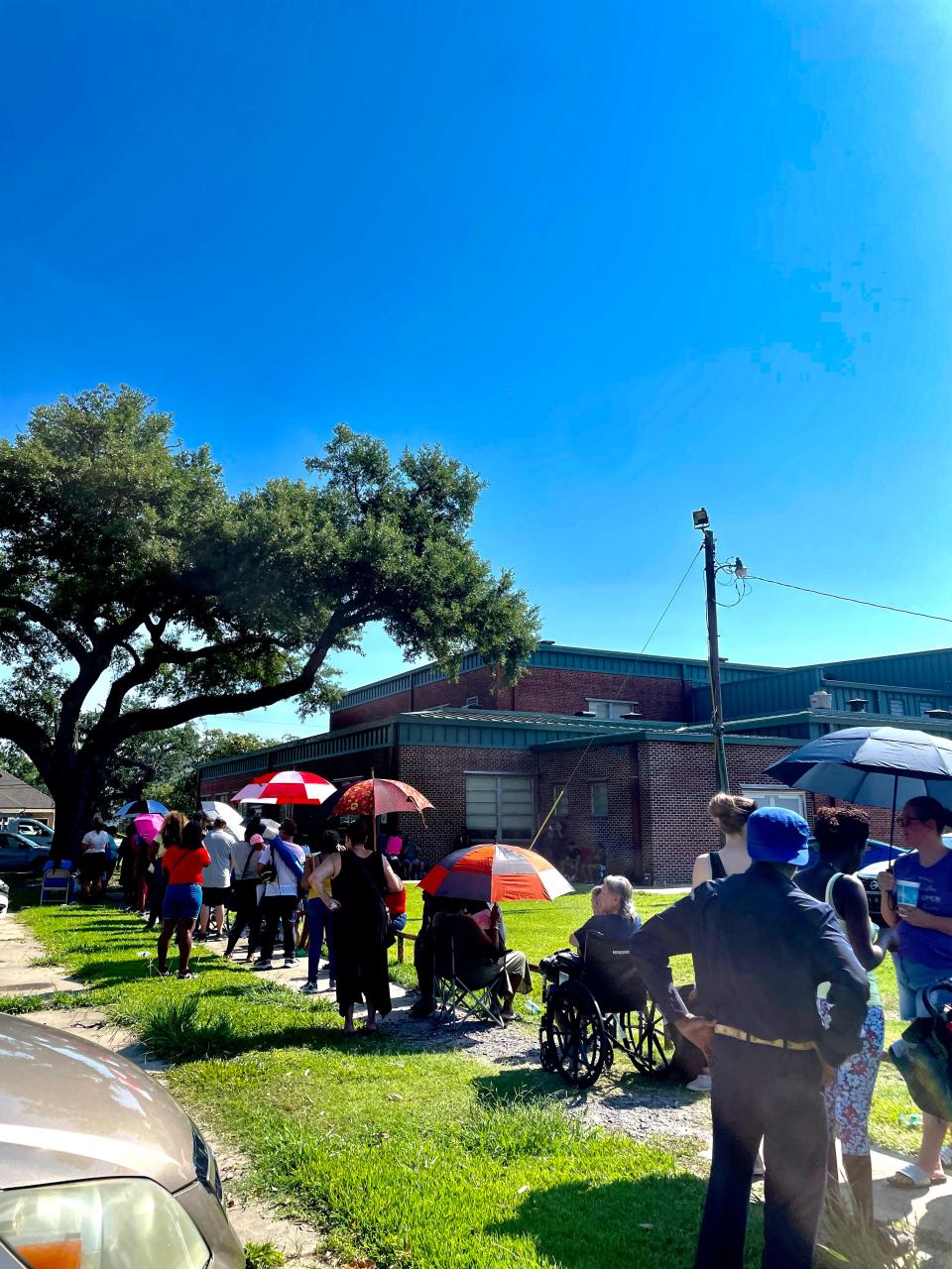 Hundreds braved the 100+ heat index and lined up outside of the Houma Municipal Auditorium at a chance for HUD Vouchers, June 30. Houma Police Department called three medical emergencies.