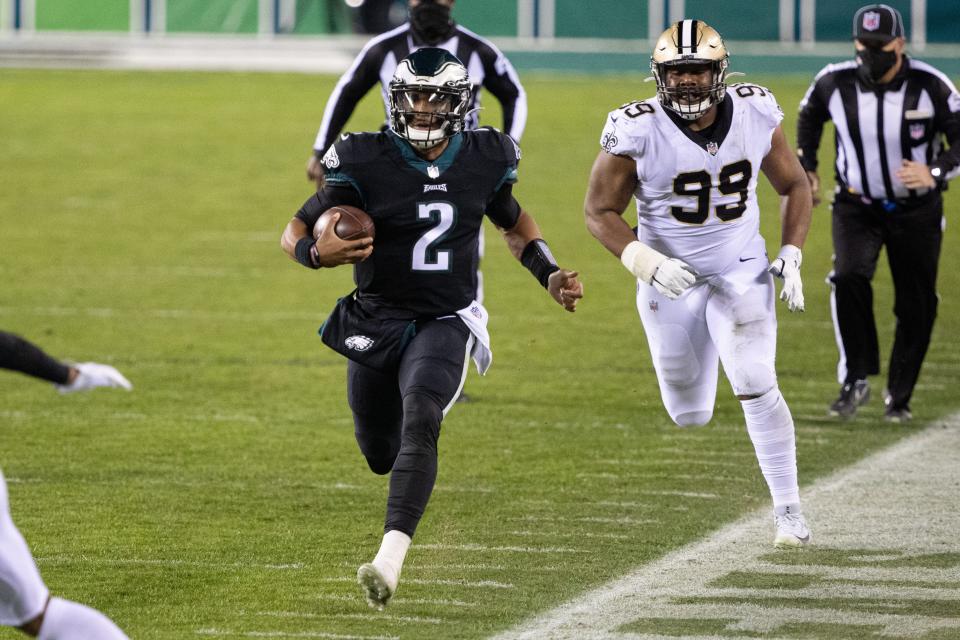 Philadelphia Eagles quarterback Jalen Hurts (2) runs with the ball past New Orleans Saints defensive tackle Shy Tuttle (99) during the second quarter at Lincoln Financial Field.