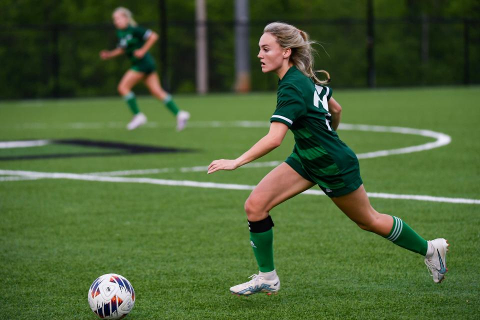Easley's Emma Grace Hemphill (25) takes the ball down the field during a game at Easley High School on Friday, April 21, 2023. 