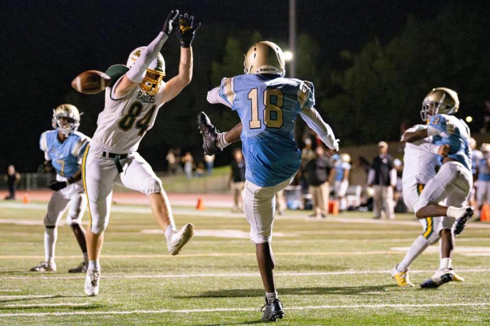 Rio Americano Raiders defensive end Chase Dinaburg (84) blocks a punt during the first half of the game against Burbank at Del Campo High School on Friday.