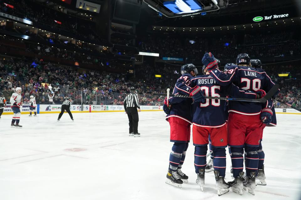 The Blue Jackets celebrate a goal by Columbus Blue Jackets left wing Patrik Laine (29) during the third period of the NHL game between the Columbus Blue Jackets and the Washington Capitals at Nationwide Arena in Columbus, Ohio, on Thursday, March 17, 2022. 