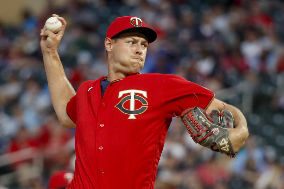 Minnesota Twins relief pitcher Trevor Megill throws to a Kansas City Royals batter during the fourth inning of a baseball game Friday, May 27, 2022, in Minneapolis. (AP Photo/Bruce Kluckhohn)