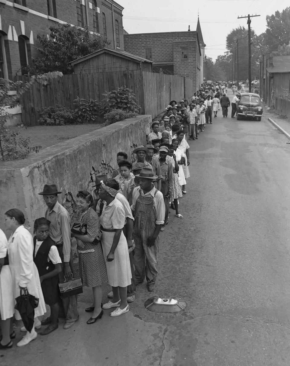 A line of African American voters, over two blocks long, await their chance to get to the polls before 8 o'clock, July 17, 1946, in gubernatorial candidate James V. Carmichael's hometown of Marietta, Ga. as voting in Georgia's primary got underway.  In other places around Georgia, blacks and whites voted together.  (AP Photo)