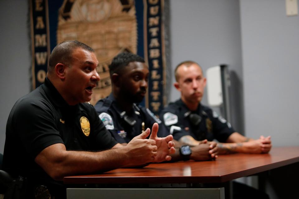 Members of the Fort Myers Police department, from left, Sgt. Domonic Zammit, training supervisor, Ian McMillion, officer in training, and Anthony Townsend, officer trainer, speak to The News-Press during an interview on Friday, July 28, 2022.