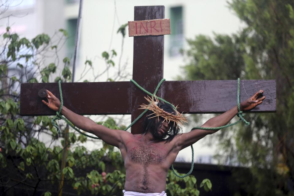 A performer takes part in a re-enactment of the death of Jesus Christ, on Good Friday in Lagos