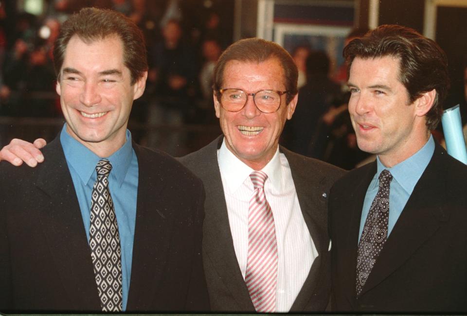 Timothy Dalton left, Roger Moore and Pierce Brosnan, three of the actors who have portrayed the English secret agent James Bond in the Bond movies line up at a central London cinema to celebrate the life of Albert R. "Cubby" Broccoli Sunday, Nov. 17, 1996. The American film producer Broccoli was responsible for the seventeen Bond movies from 'Dr. No' to the recent 'Goldeneye'.(AP Photo/Alastair Grant)