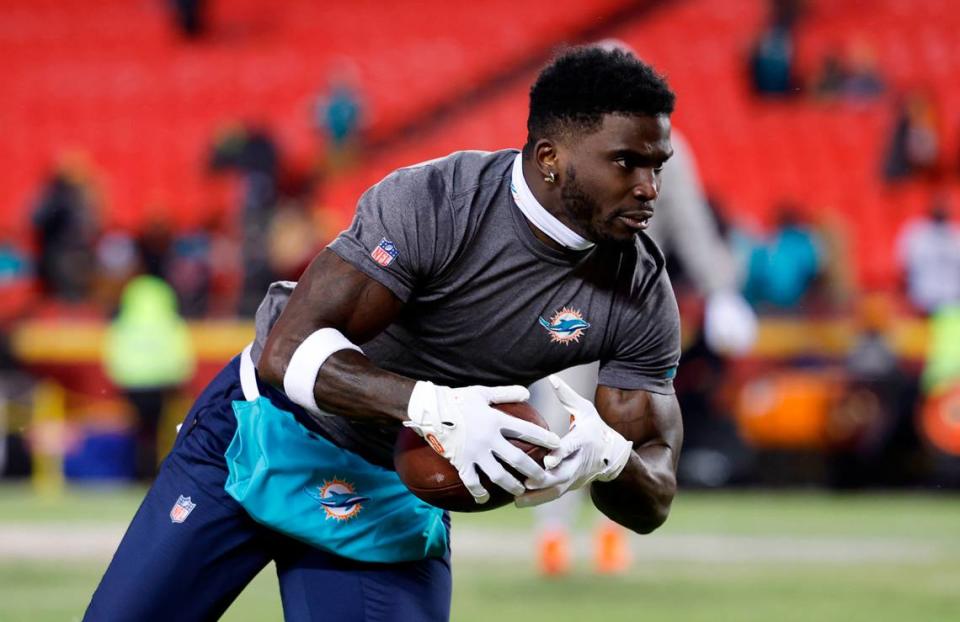 Miami Dolphins wide receiver Tyreek Hill (10) runs during pregame warmups before an NFL wild-card playoff football game against the Kansas City Chiefs at GEHA Field at Arrowhead Stadium in Kansas City, Missouri, on Saturday, January 13, 2024.