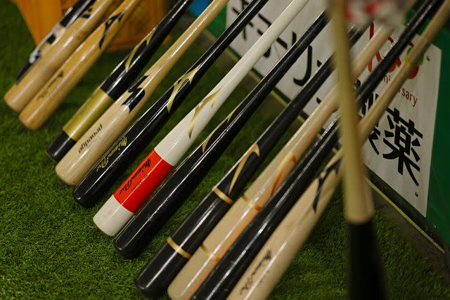 <p>Irwin Wong</p> Bats lined up for practice at the Tokyo Dome.