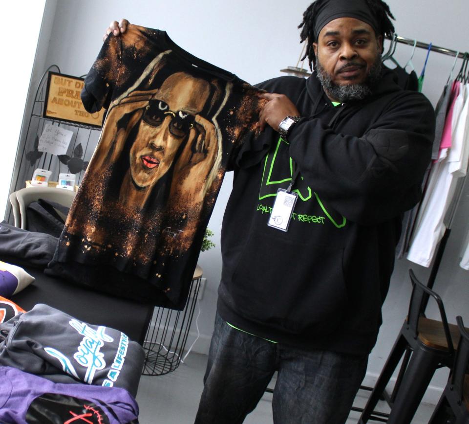 Cheat Designs owner Lloyd Cheatham Jr. of Detroit sold his custom T-shirts and paintings at a recent pop-up shop hosted at Monroe Nutrition. The former Monroe resident combines his love of art with fashion.