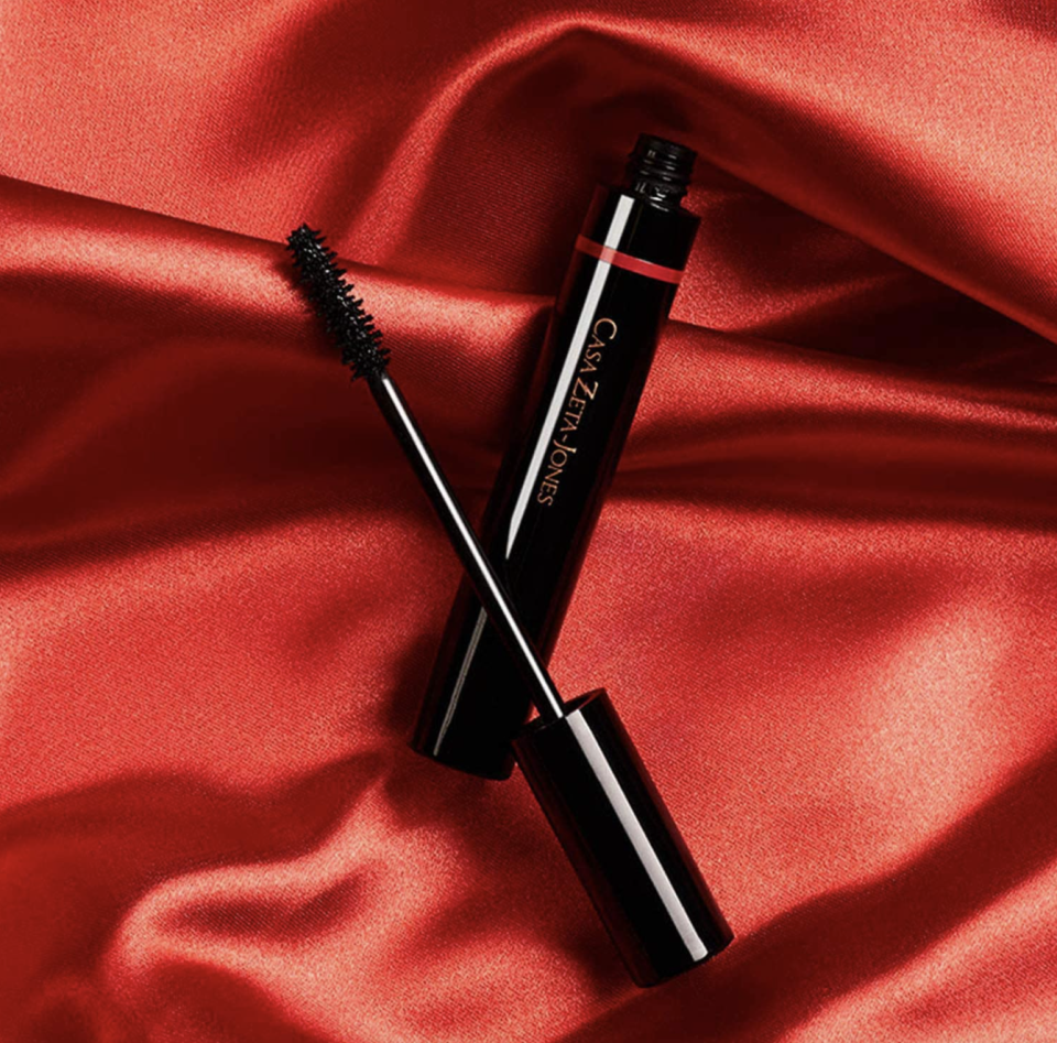 black tube of CASA ZETA-JONES My Mascara on red silk background