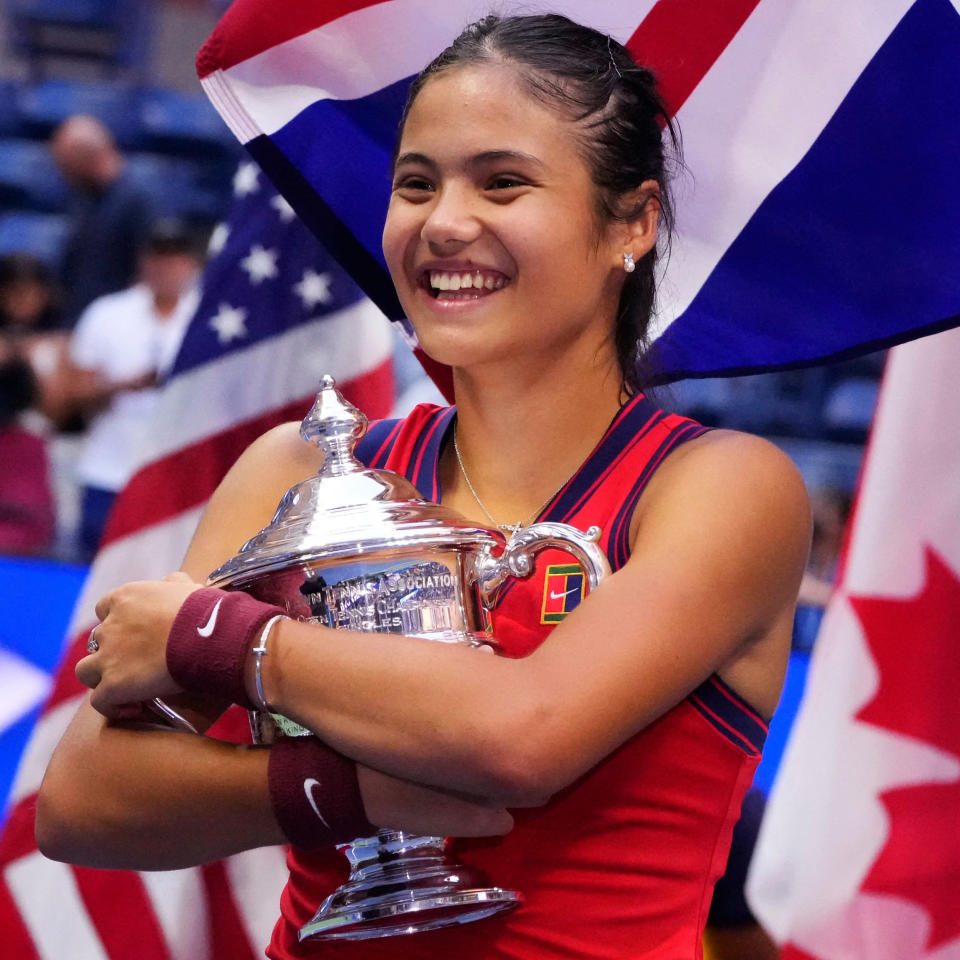 Britain's Emma Raducanu celebrates with the trophy after winning the 2021 US Open Tennis tournament women's final match against Canada's Leylah Fernandez. (Timothy A. Clary / AFP - Getty Images)