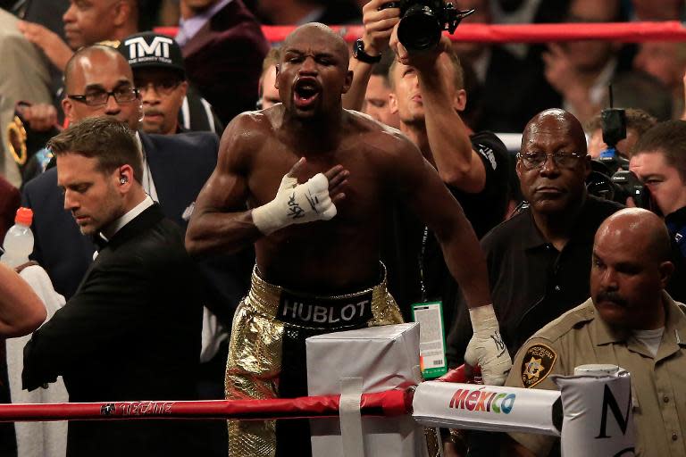 Floyd Mayweather Jr. celebrates his victory over Manny Pacquiao in their welterweight unification bout