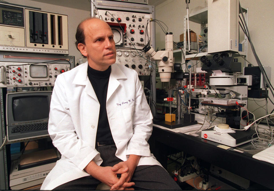 FILE - In this Friday, March 1, 1996, file photo, Michael Milken, the famed ex-junk bond financier who once was at the center of the biggest Wall Street securities fraud scandal, poses for a photo while visiting the UCLA Nutrition Research Laboratory in the Westwood area of Los Angeles. George Washington University will name its public health school for Michael Milken, the 1980s king of Wall Street "junk" bonds who spent 22 months in prison but later devoted himself to philanthropy and advocated for medical research. On Tuesday, March 11, 2014, the university announced gifts totaling $80 million to address public health challenges from Milken and Sumner Redstone. (AP Photo/Damian Dovarganes)